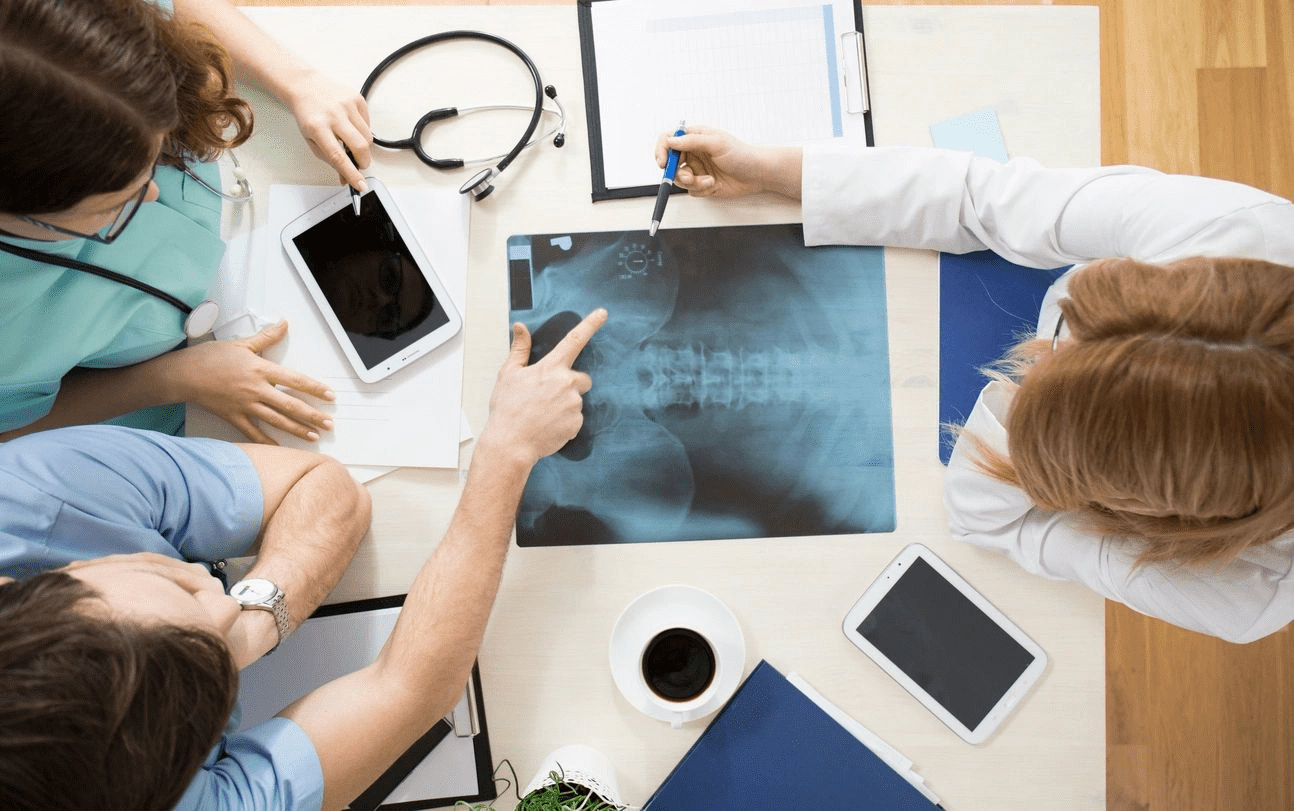 doctors looking at a chest x-ray