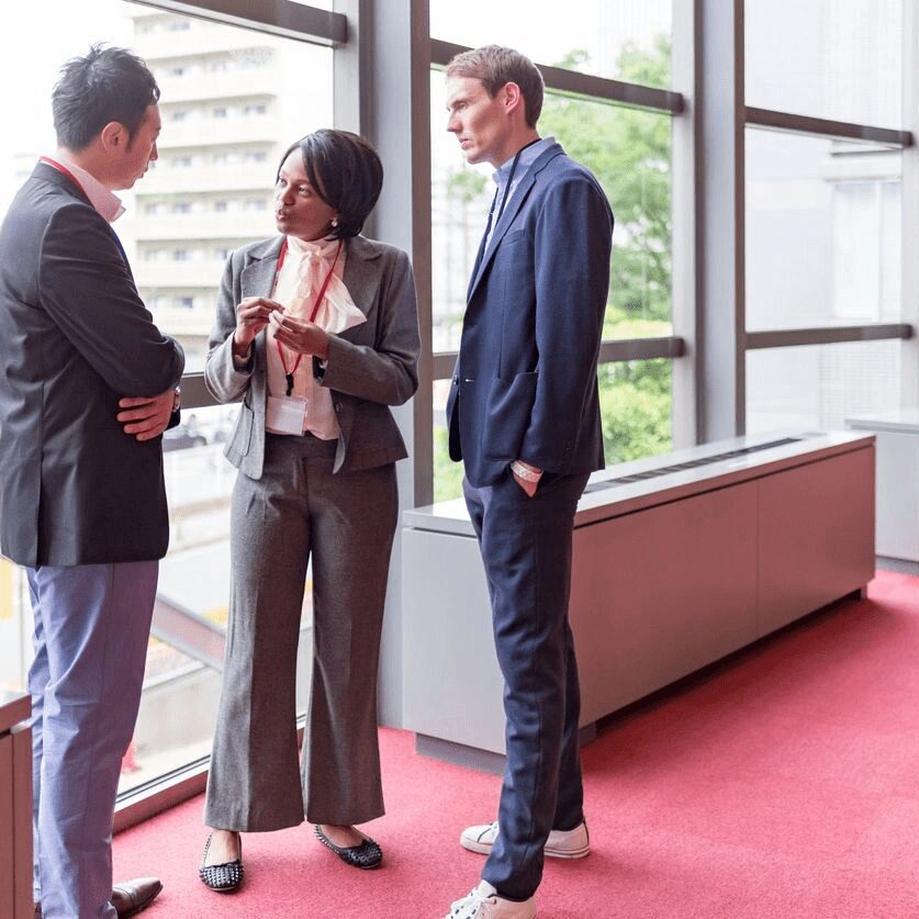 three professionals having a discussion